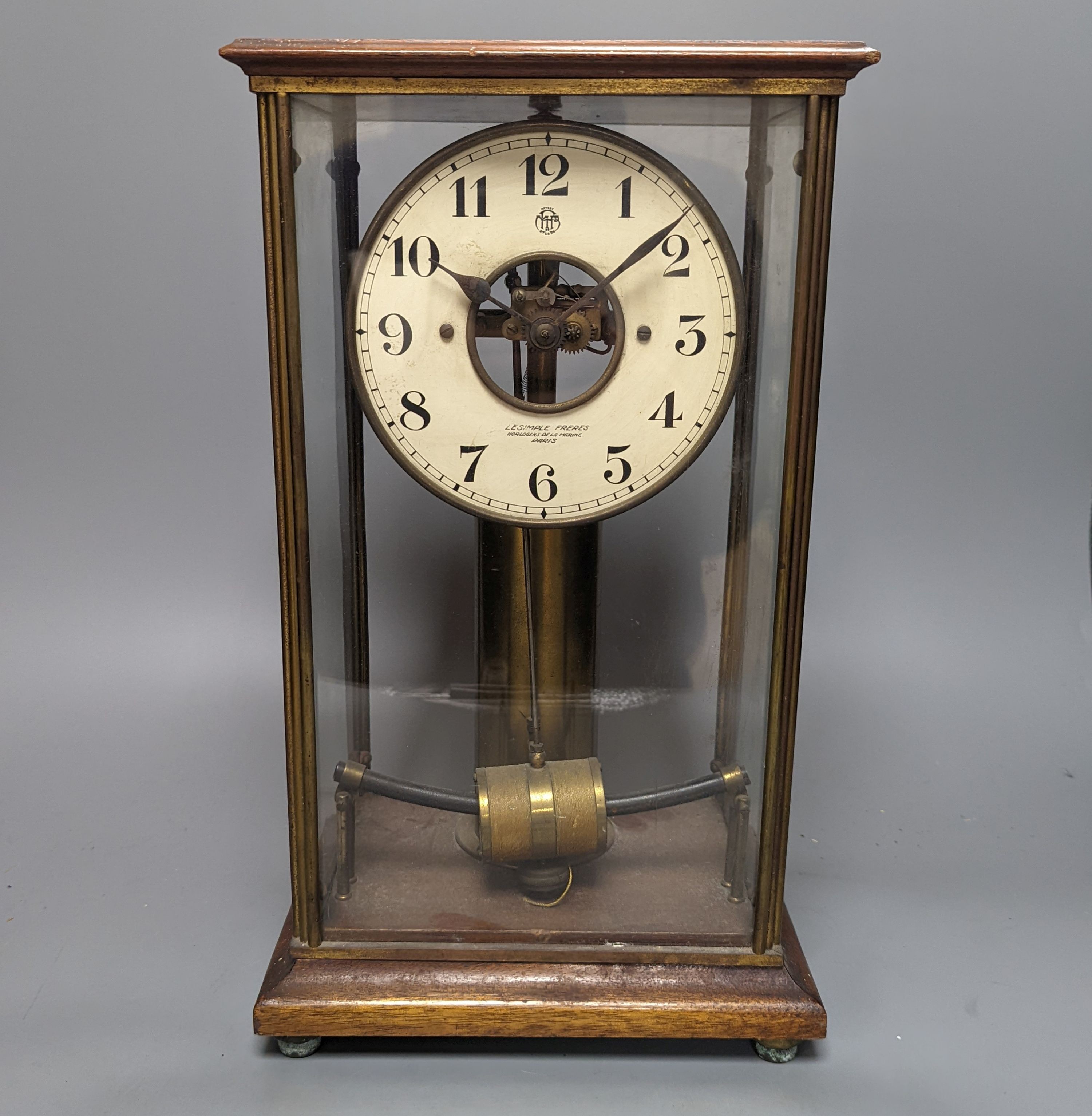 A Maurice Favre - Boulle electric pendulum clock, in a brass and mahogany four glass case, back-glass lacking, H.37.5cm